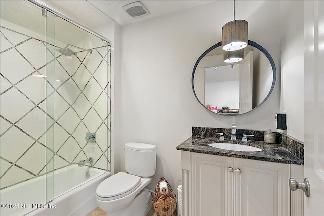 301 S Roscoe Blvd, Ponte Vedra Beach, FL 32082 - bathroom featuring vanity, bath / shower combo with glass door, toilet, and visible vents