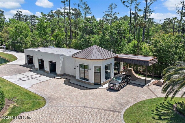 301 S Roscoe Blvd, Ponte Vedra Beach, FL 32082 - back of property with stucco siding and metal roof