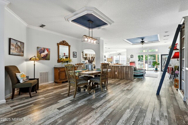 1417 Marlee Rd, Saint Johns, FL 32259 - dining area featuring wood finished floors, ornamental molding, baseboards, ceiling fan, and a textured ceiling
