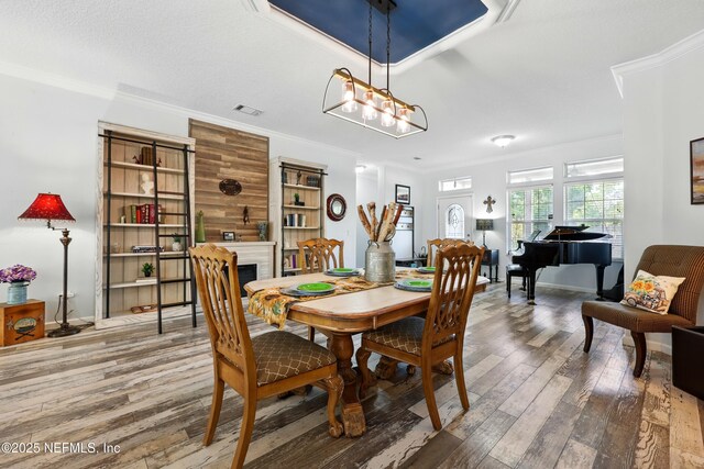 1417 Marlee Rd, Saint Johns, FL 32259 - dining room with hardwood / wood-style floors, ornamental molding, a fireplace, and baseboards