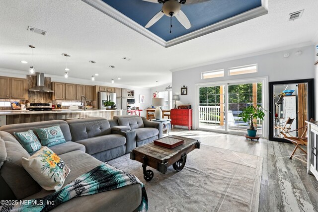1417 Marlee Rd, Saint Johns, FL 32259 - living room with ornamental molding, light wood-style floors, ceiling fan, and recessed lighting