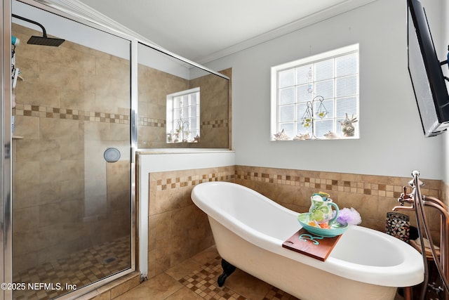 1417 Marlee Rd, Saint Johns, FL 32259 - bathroom featuring tile walls, a shower stall, a soaking tub, tile patterned floors, and ornamental molding