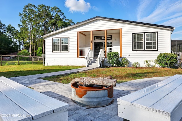 1417 Marlee Rd, Saint Johns, FL 32259 - view of front of house with a fire pit and a patio