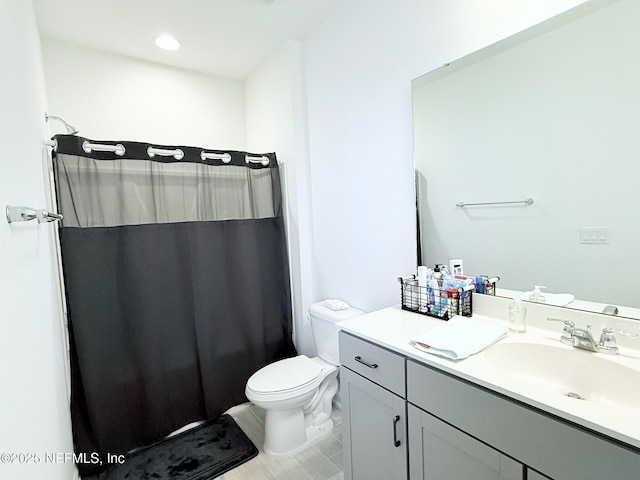 full bathroom with vanity, toilet, and curtained shower