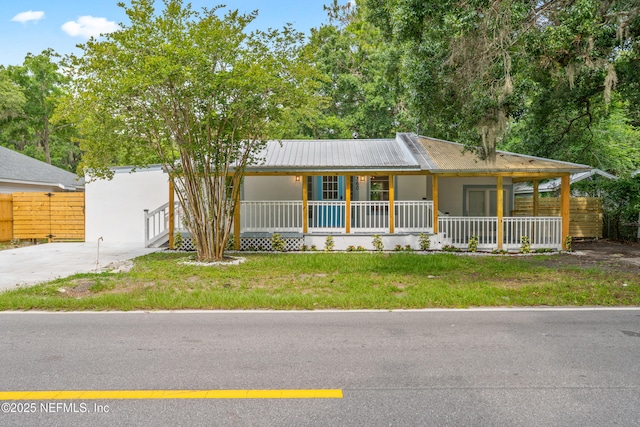 360 Varella Ave, Saint Augustine, FL 32084 - view of front facade featuring covered porch and metal roof