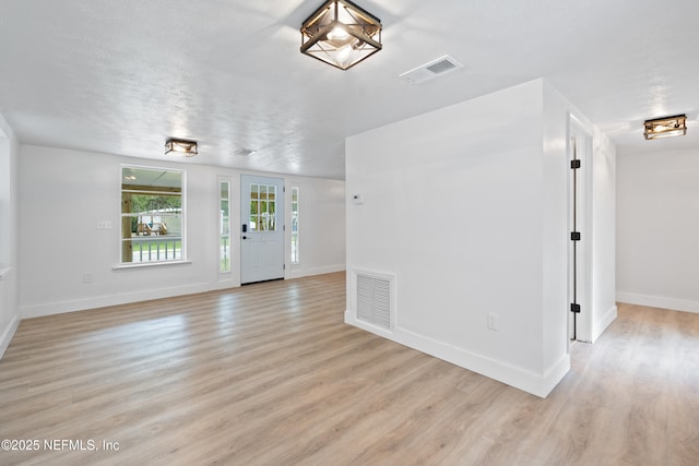 360 Varella Ave, Saint Augustine, FL 32084 - unfurnished living room featuring light wood-style flooring and baseboards