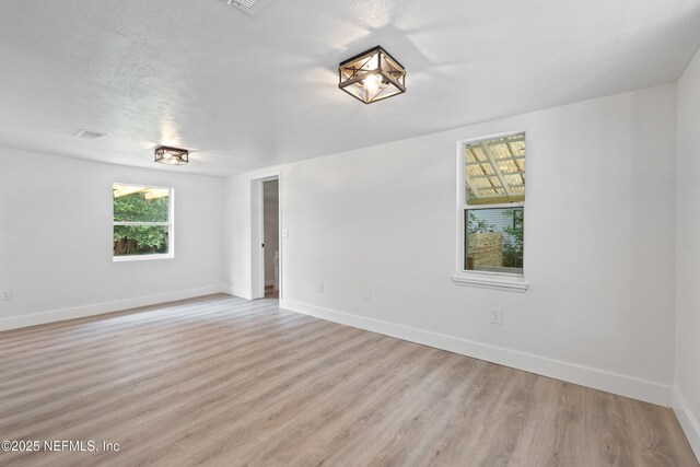 360 Varella Ave, Saint Augustine, FL 32084 - empty room with light wood-type flooring and baseboards