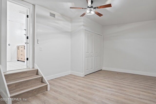 360 Varella Ave, Saint Augustine, FL 32084 - staircase featuring ceiling fan, wood finished floors, and baseboards
