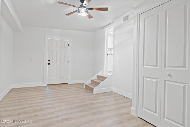 360 Varella Ave, Saint Augustine, FL 32084 - foyer entrance with a ceiling fan, baseboards, light wood-style flooring, and stairway