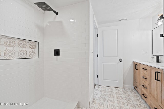 360 Varella Ave, Saint Augustine, FL 32084 - full bath featuring a tile shower, vanity, and baseboards
