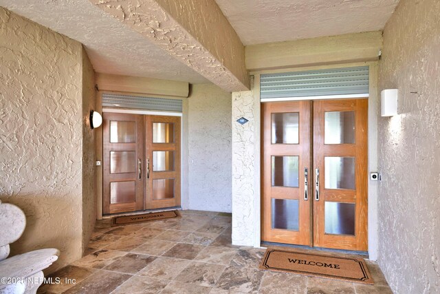 948 Spinnakers Reach Dr, Ponte Vedra Beach, FL 32082 - view of exterior entry featuring french doors and stucco siding