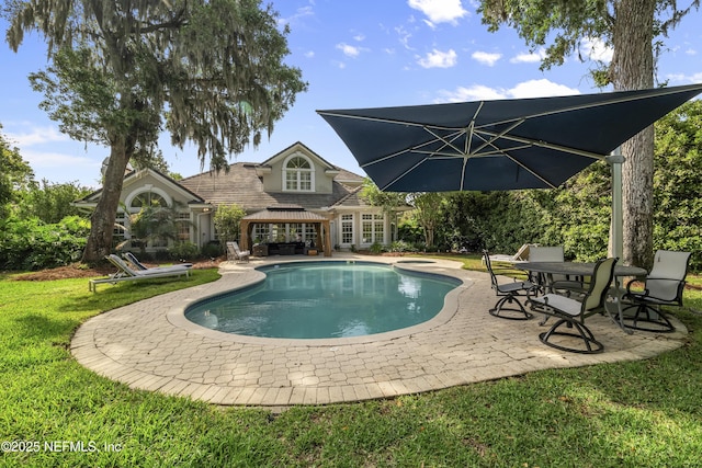 pool with a patio, a gazebo, and a yard