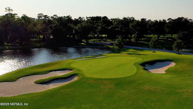 view of community with a water view and golf course view