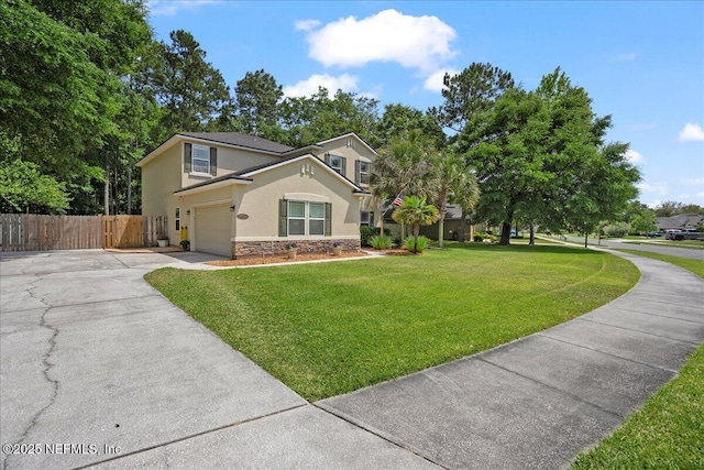 view of front of house with fence, stone siding, concrete driveway, stucco siding, and a front yard