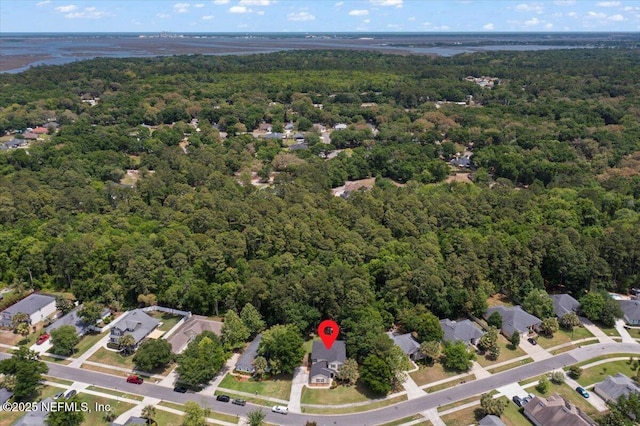 bird's eye view with a wooded view and a residential view