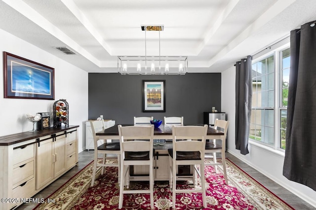 3753 Old Hickory Ln, Orange Park, FL 32065 - dining room featuring visible vents, baseboards, dark wood-style floors, a tray ceiling, and a notable chandelier
