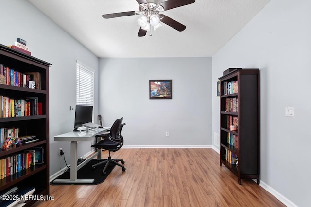 3753 Old Hickory Ln, Orange Park, FL 32065 - office area with baseboards, a ceiling fan, and wood finished floors