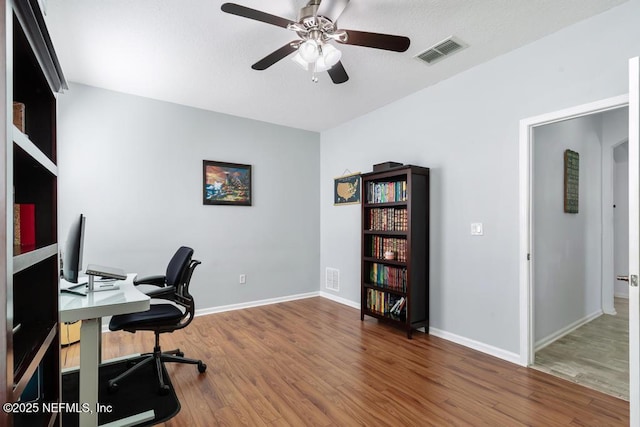3753 Old Hickory Ln, Orange Park, FL 32065 - home office with baseboards, ceiling fan, visible vents, and wood finished floors
