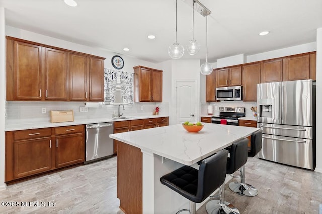 3753 Old Hickory Ln, Orange Park, FL 32065 - kitchen featuring stainless steel appliances, tasteful backsplash, a sink, and a center island