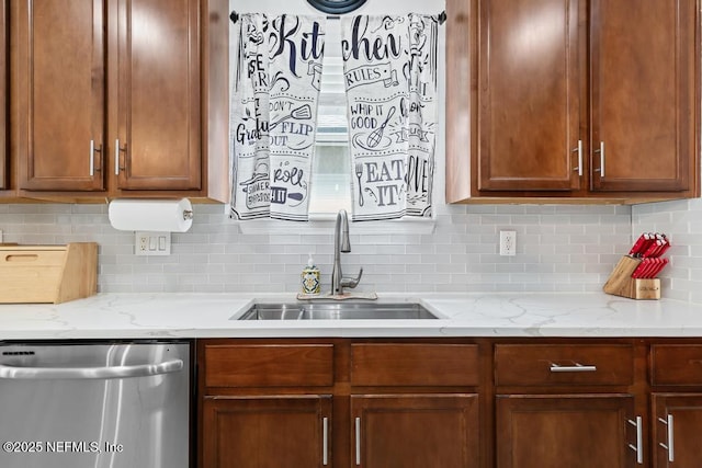 3753 Old Hickory Ln, Orange Park, FL 32065 - kitchen with brown cabinetry, backsplash, light stone countertops, dishwasher, and a sink