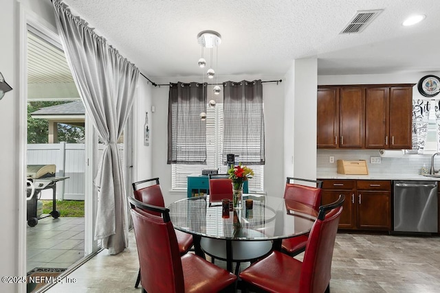 3753 Old Hickory Ln, Orange Park, FL 32065 - dining room featuring visible vents and a textured ceiling