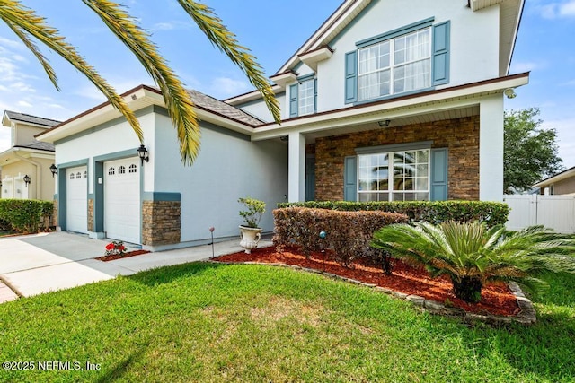 3753 Old Hickory Ln, Orange Park, FL 32065 - traditional home featuring concrete driveway, an attached garage, stone siding, and stucco siding
