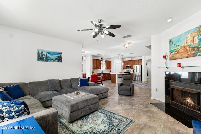 3753 Old Hickory Ln, Orange Park, FL 32065 - living area with ceiling fan, visible vents, a tile fireplace, recessed lighting, and light wood-style flooring