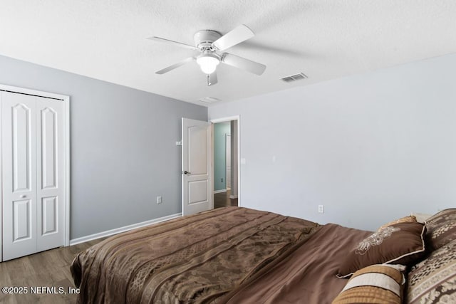 3753 Old Hickory Ln, Orange Park, FL 32065 - bedroom featuring visible vents, a closet, wood finished floors, baseboards, and ceiling fan