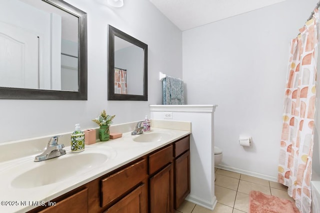 3753 Old Hickory Ln, Orange Park, FL 32065 - bathroom featuring a sink, tile patterned flooring, toilet, and double vanity