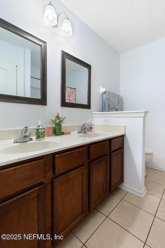 3753 Old Hickory Ln, Orange Park, FL 32065 - full bath featuring double vanity, toilet, tile patterned floors, and a sink