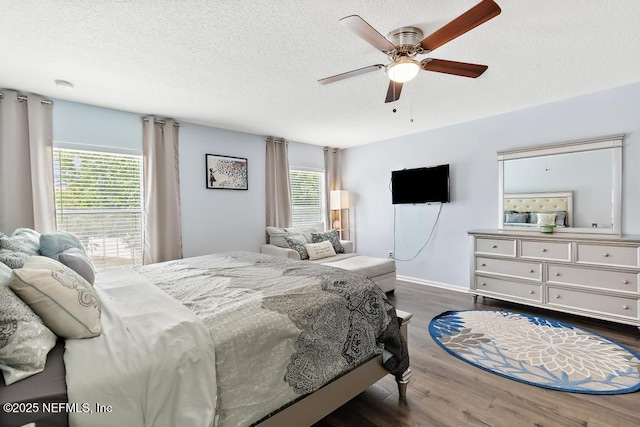 3753 Old Hickory Ln, Orange Park, FL 32065 - bedroom with ceiling fan, multiple windows, a textured ceiling, and dark wood-type flooring