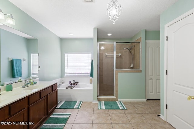 3753 Old Hickory Ln, Orange Park, FL 32065 - full bathroom featuring a garden tub, vanity, visible vents, tile patterned floors, and a shower stall