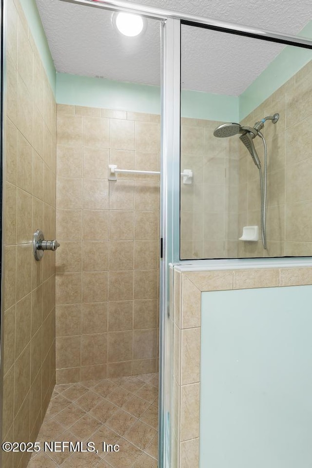 3753 Old Hickory Ln, Orange Park, FL 32065 - bathroom with a textured ceiling and a shower stall