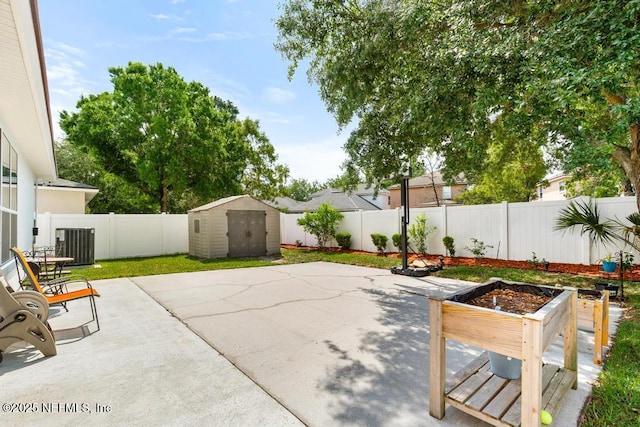 3753 Old Hickory Ln, Orange Park, FL 32065 - view of patio featuring a fenced backyard, an outbuilding, central air condition unit, and a shed