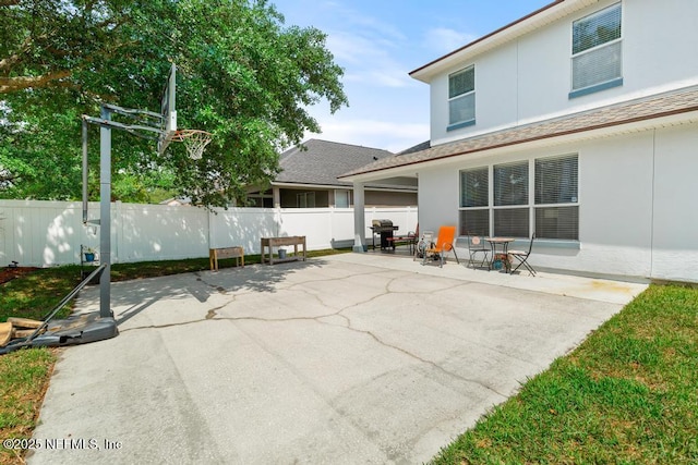 3753 Old Hickory Ln, Orange Park, FL 32065 - back of house with fence, a patio, and stucco siding