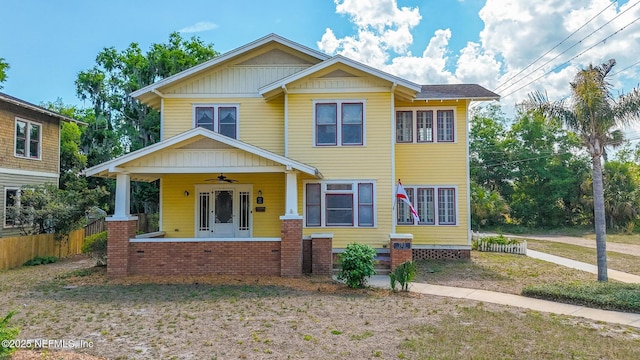 703 Emmett St, Palatka, FL 32177 - view of front facade with covered porch, fence, and a ceiling fan