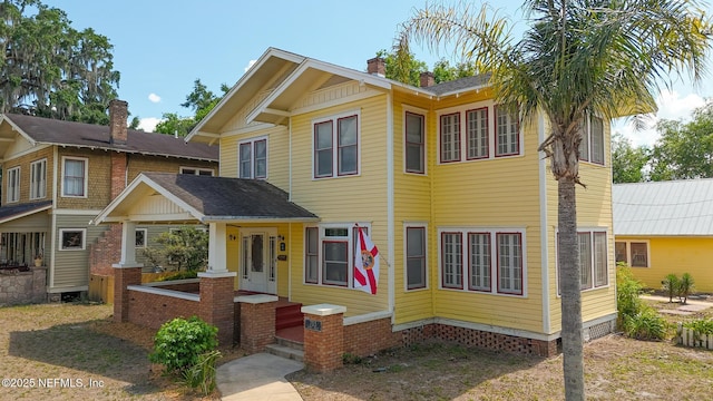 703 Emmett St, Palatka, FL 32177 - view of front of house with a chimney