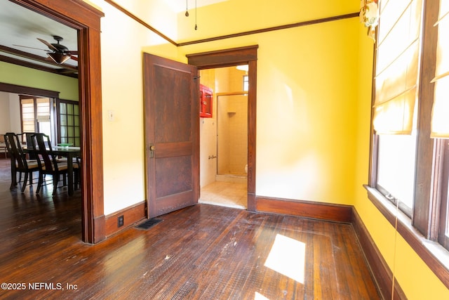 703 Emmett St, Palatka, FL 32177 - spare room with visible vents, a ceiling fan, dark wood finished floors, and baseboards