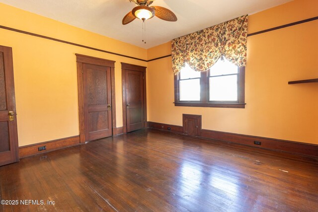 703 Emmett St, Palatka, FL 32177 - unfurnished bedroom with a ceiling fan, hardwood / wood-style floors, and baseboards