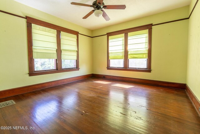 703 Emmett St, Palatka, FL 32177 - spare room with hardwood / wood-style floors, visible vents, plenty of natural light, and baseboards