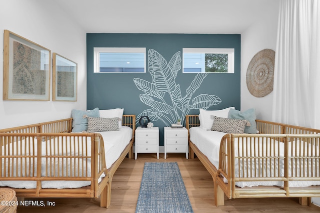 bedroom featuring wood finished floors