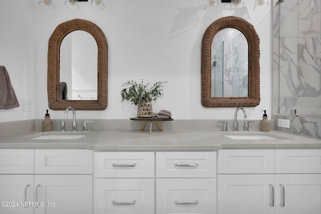 full bathroom featuring double vanity and a sink