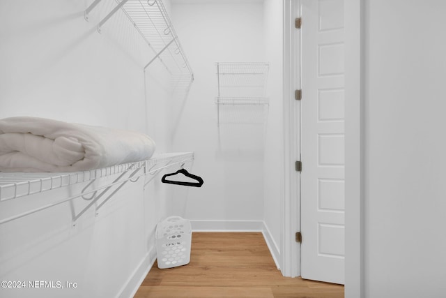 spacious closet with light wood-style flooring