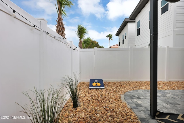 view of yard with a fenced backyard and a patio area