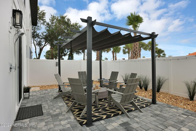 view of patio / terrace featuring a fenced backyard and a pergola