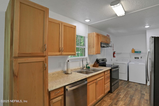 237 Riberia St, Saint Augustine, FL 32084 - kitchen featuring a textured ceiling, separate washer and dryer, a sink, dark wood finished floors, and appliances with stainless steel finishes