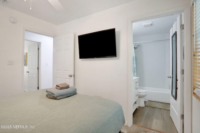 237 Riberia St, Saint Augustine, FL 32084 - bedroom featuring connected bathroom, ceiling fan, and wood finished floors