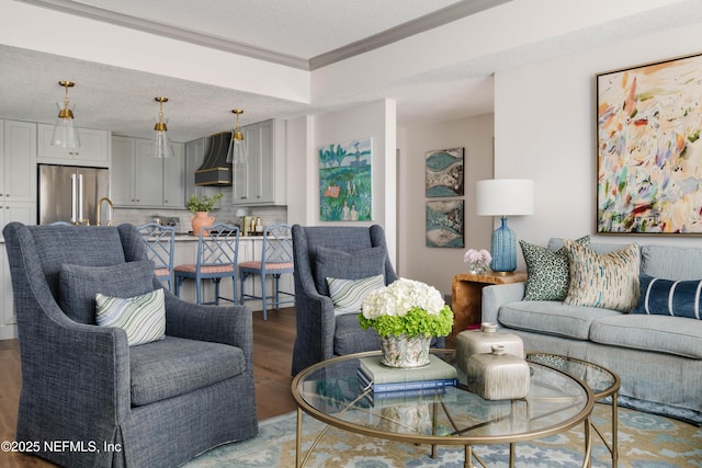 1478 Riverplace Blvd Unit 1008, Jacksonville, FL 32207 - living room with wood finished floors, crown molding, and a textured ceiling