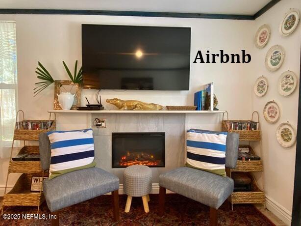 sitting room featuring baseboards