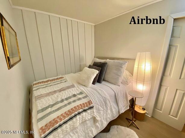 bedroom with wood finished floors